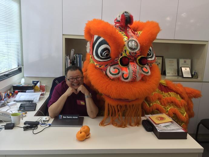 Keller employee with dragon celebrating Lunar New Year